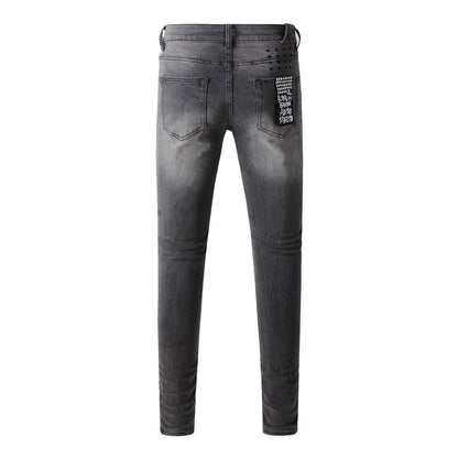 Urban Gray Ripped Jeans with Bold Black Graffiti Accents 3003