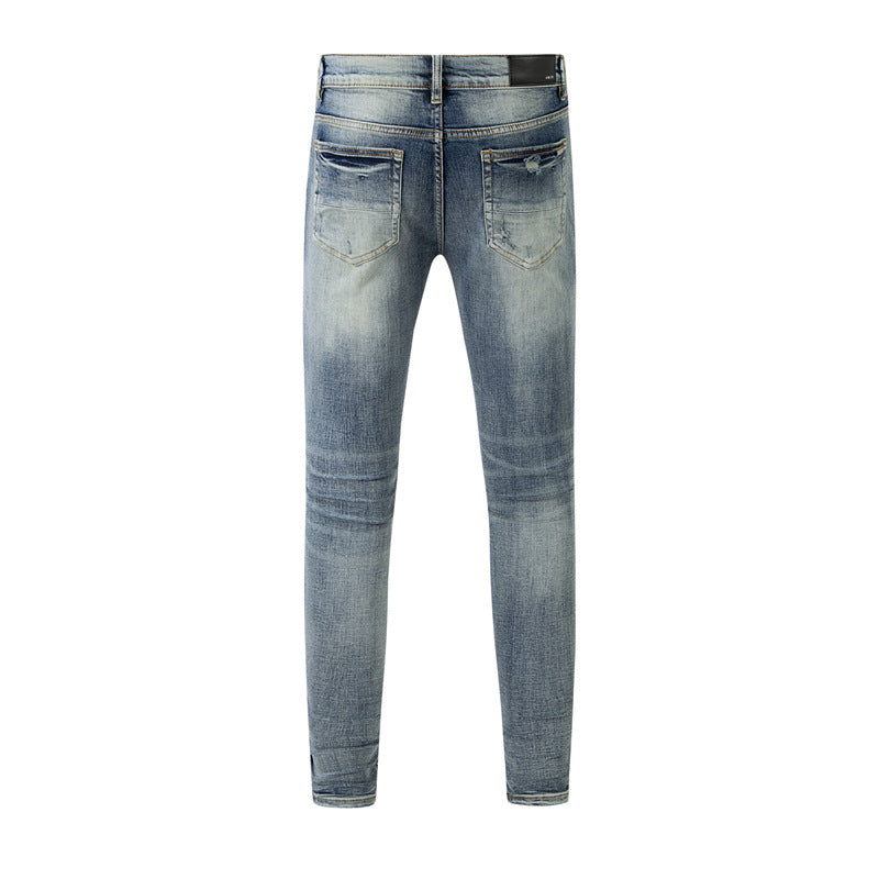 Light Blue Distressed Jeans with Washed Effect and Stylish Rips